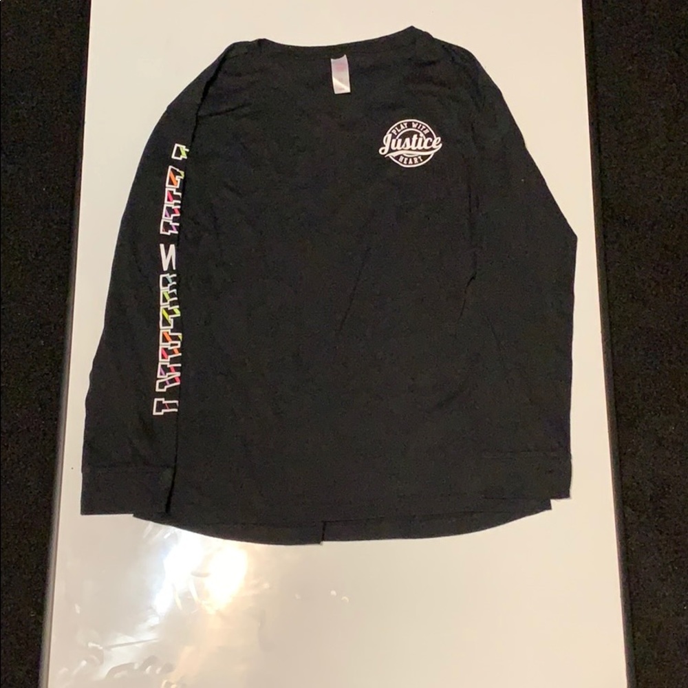 A girls black long sleeve shirt from Justice.